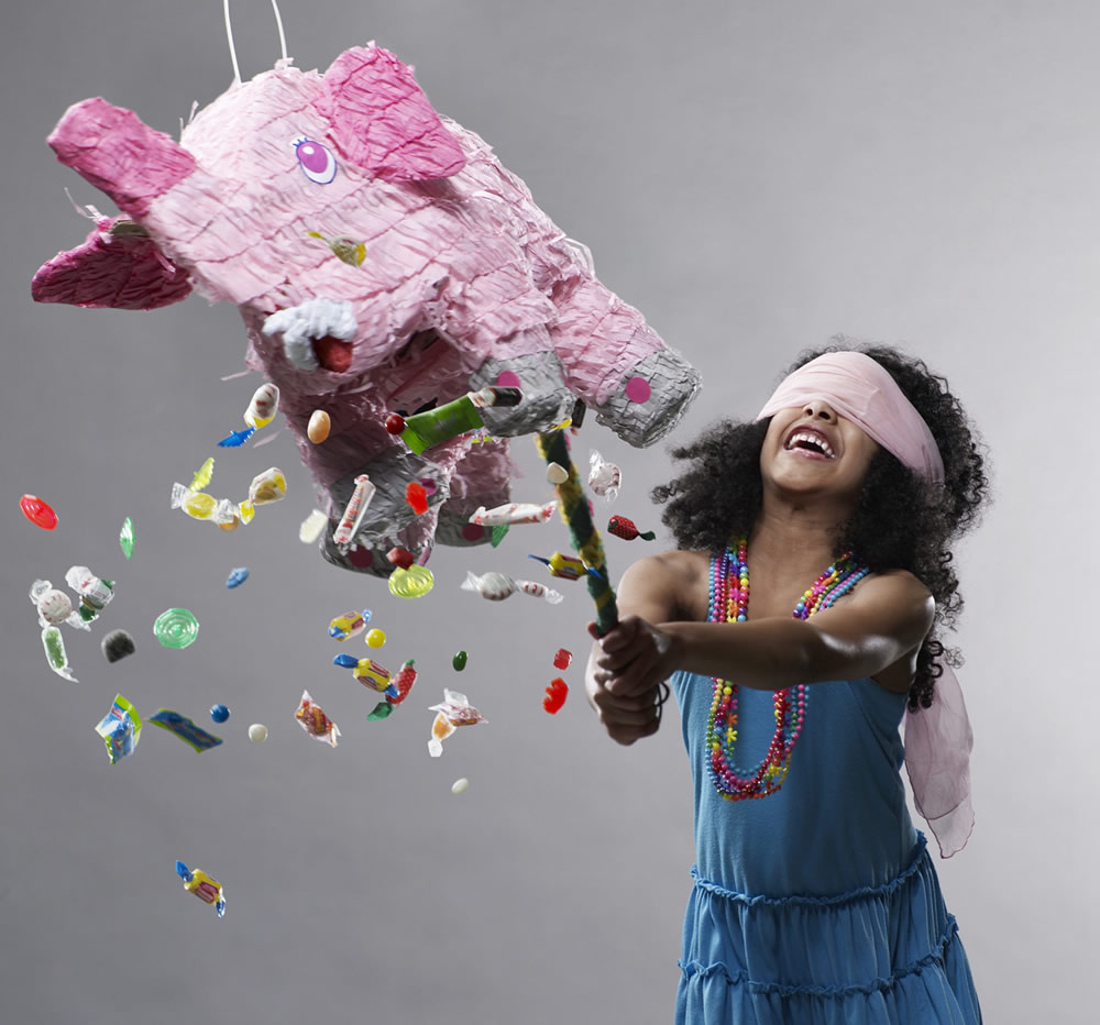 Child playing pinjata game